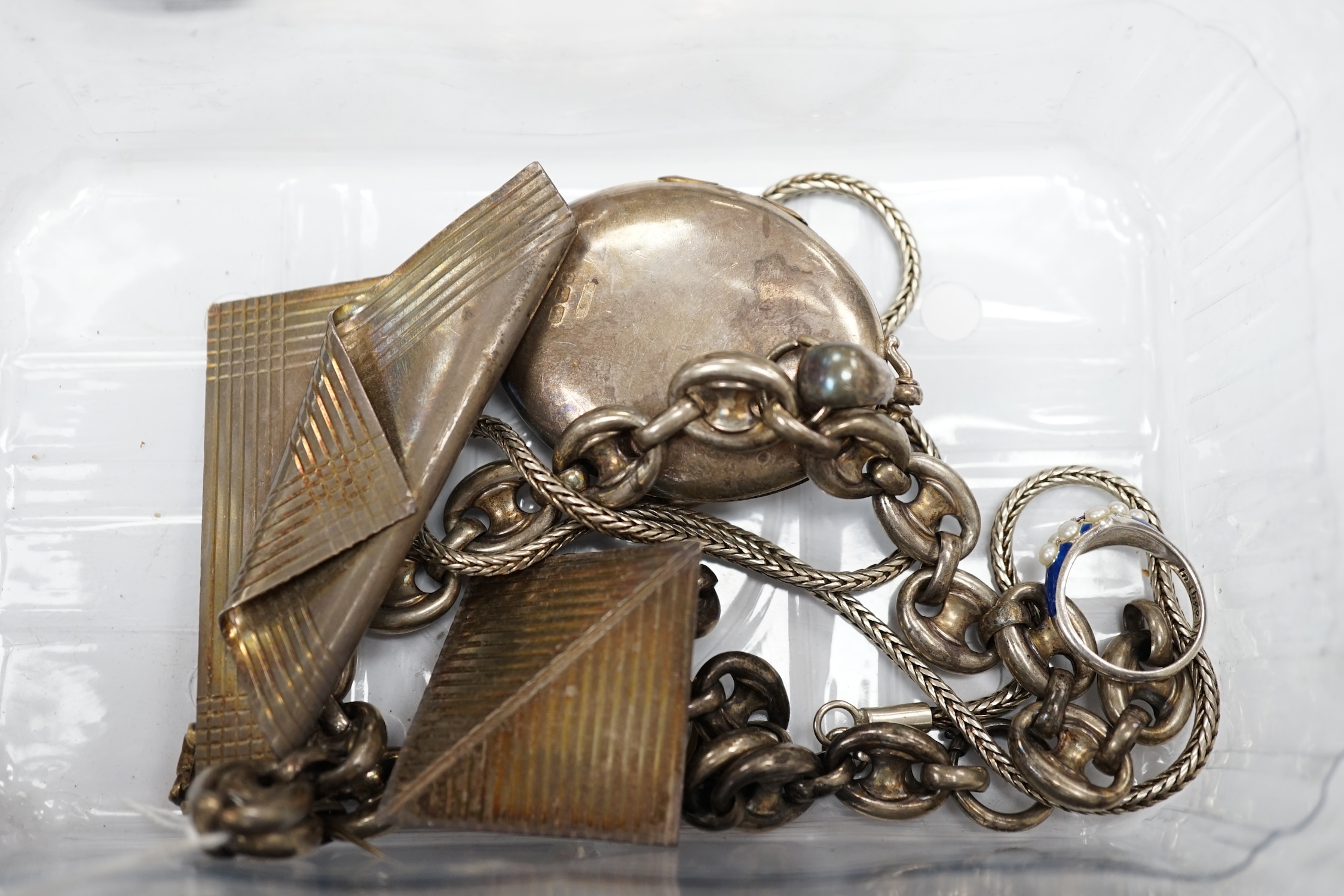 A late Victorian silver oval locket on a white metal chain and other jewellery etc., including three rings, a pocket watch and two modern silver brooches by Clive Edward Burr, largest 75mm. Condition - varies, poor to fa